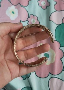 Elegant Gold Tone Twisted Bangle