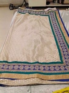 Embellished Beige Saree with Blue Border