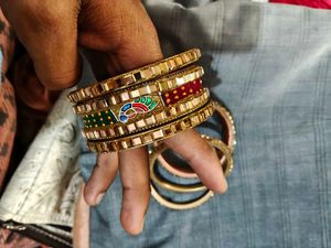 Set of Golden Bangles with Green Embellishments