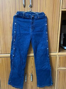 High-Waisted Flare Jeans with Button Detail