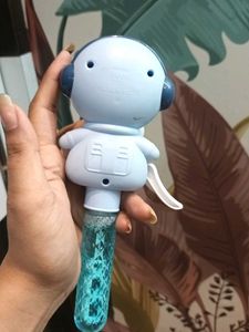 Bubble making toy with fan
