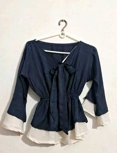 Chic Navy Blue Peplum Top with Bow Detail