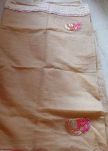 Elegant Beige colour Embroidered Saree
