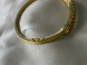 Elegant 22kt Gold Tone Bangle with Red &amp; Green Sto