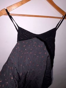 Black shiny polka dot dress