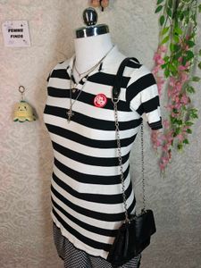 Women's black and white striped polo tee