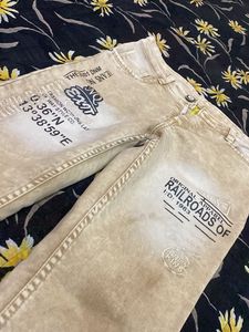 Stylish Beige Jeans with Graphic Print