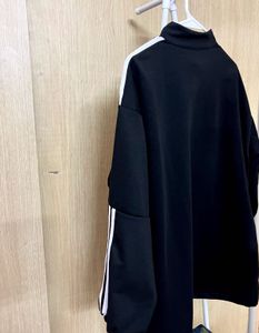 Sporty Black Zip-Up Sweatshirt with White Stripes