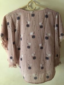 Chic Floral Print Top with Embellished Neckline