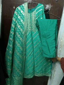 Elegant Green Saree with Gold Floral Print