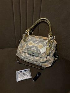 Chic Coach Shoulder Bag with Gold Accents