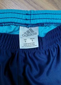 Navy blue and cyan Adidas shorts that combines spo