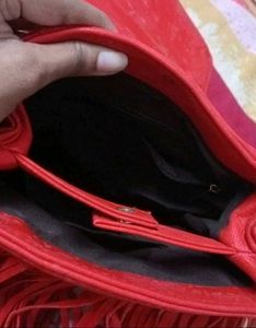 Chic Red Handbag with Gold Accent Handle