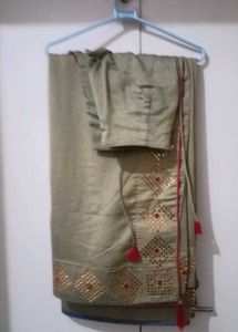 Elegant Beige Saree with Gold Embellishments