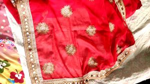 Red saree with mirror work border