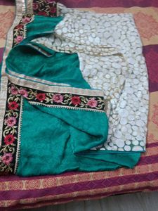 Elegant Teal Saree with Intricate Border