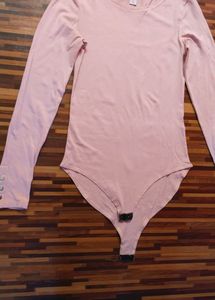 Peach Full-Sleeve Bodysuit by Amisu