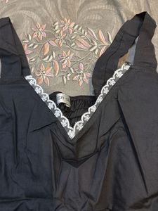 Chic Black Peplum Top with Lace Trim