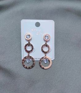 Roman Branded Earrings With Ad Stone