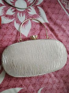 27.Sparkly Oval Clutch Bag