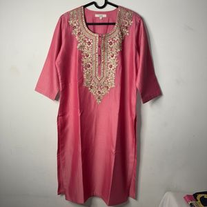 Pink Kurta set with pants and dupatta.