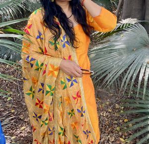 Musturd colour suit with fulkari dupatta