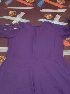 Elegant Purple Gown with Gold Embellishments