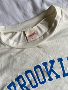 Urbanic - Cream Brooklyn Graphic Crop Top