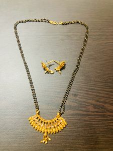 Shining Golden Mangalsutra With Ear Tops Medium Length With Stones/Diamond