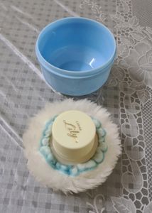 Baby powder puff with a refill container