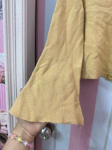 beige flared cardigan