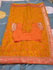 Elegant Orange Saree with Embellishments