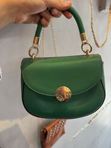 Chic Green Handbag with Gold Accent