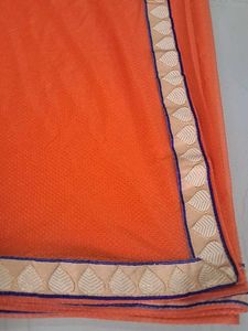 Vibrant Orange Saree with Embellished Border