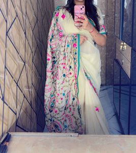 Elegant Cream Saree with Floral Embroidery