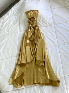 Elegant Gold Strapless Gown with Bow Detail