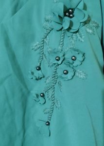 Aqua Green Top With Embroidery Design In The Front And Bell Sleeve