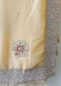 creame embellished saree with matching blouse
