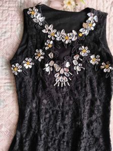 Small piece black mini dress