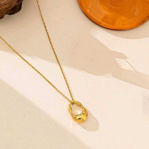 Elegant Gold Tone Pendant Necklace