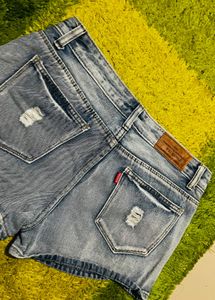 Distressed Denim Shorts with Embellishments