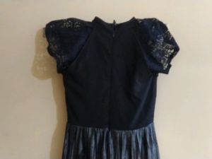 Party Wear Gown Of' S' Size Available.... Basically It's Neck Is Halter Neck ....If Any One Don't Want Sleeves Can Remove It ...On Removal It Looks Like Halter Neck ....