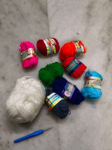Assorted Yarn Balls and Crochet Hook