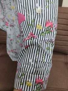 A striped black and white floral shirt.