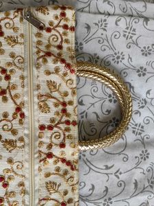 Stunning cream golden coloured handbag