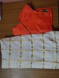 Cream saree with orange blouse