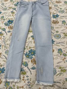 Light Wash Denim Jeans with Frayed Hem