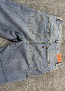 Distressed Blue Denim Jeans