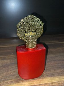 Unique Red Perfume Bottle with Ornate Cap
