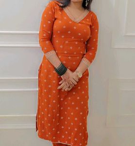 Elegant Orange Kurta Set with Intricate Embroidery